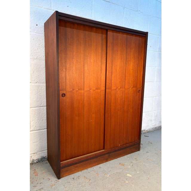 A classic example of Scandinavian design, this Mid-Century Modern Danish cabinet is crafted from richly grained rosewood...