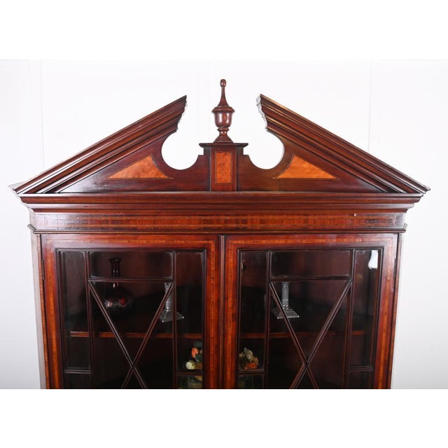 Fine george iii style mahogany corner display cabinet dating to circa 1820 the upper section with a broken swan-neck...