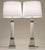 A bold and impressive matched pair of vintage Neoclassical Modern Brass Composite-stylized Column table lamps designed by...