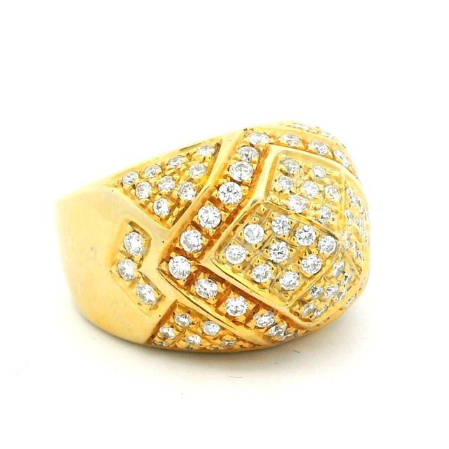 A substantial vintage Italian dome ring crafted in 18 karat yellow gold, designed with a structured pavé diamond surface...