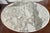 A French Provincial style oval coffee table with a genuine Italian marble top — the marble is stamped "ITALY" on the...