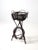 This antique Adirondack twig table plant stand is a rustic American design with a black twig tripod frame, basket-style...