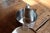 A minimalist stainless steel teapot crafted in 18/10 steel and dated 2001. The design emphasizes functionality and clean...