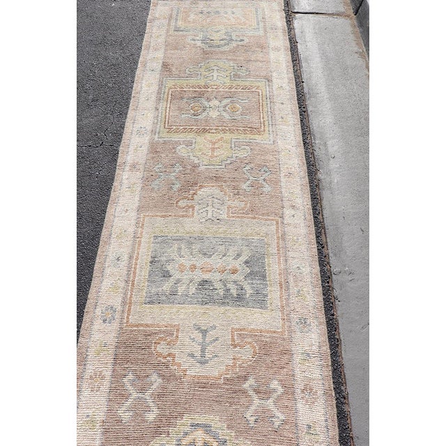 Early 21st Century Long Turkish Oushak Runner in Pale Taupe With Blue and Soft Green Motifs For Sale - Image 5 of 12