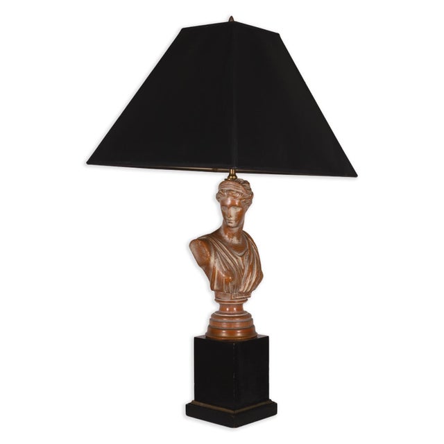 This impressive pair of neoclassical-style table lamps features ebonized wood bases with brass trim. The original limed,...