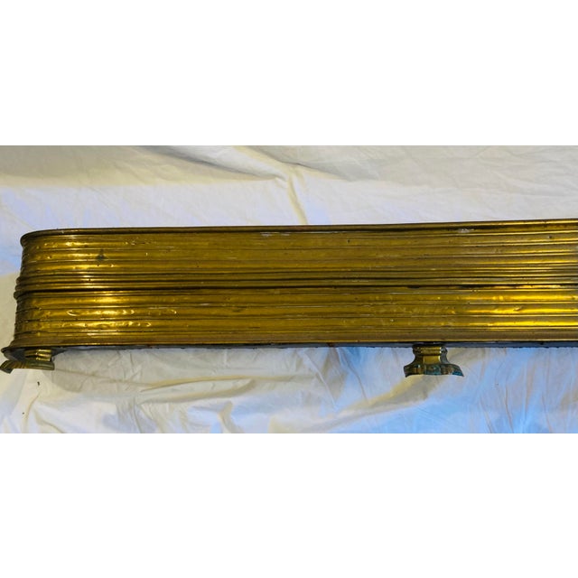 Antique large Brass fireplace fender curved at ends three lions feet