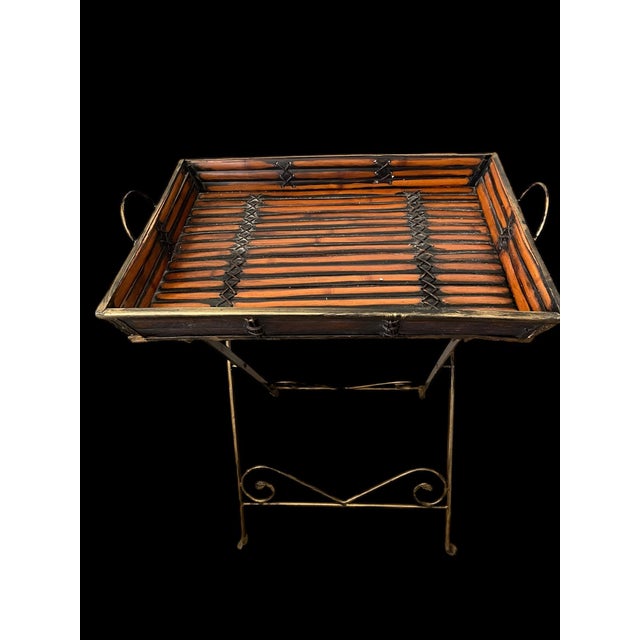 Very cool Butler foldable side table crafted from bamboo And metal. So handy to have when hosting a dinner party.