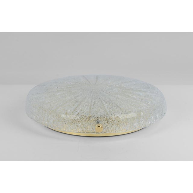 A wonderful round murano flushmount by hillebrand leuchten, germany, 1970s. Thick textured murano fixture on a brass base...