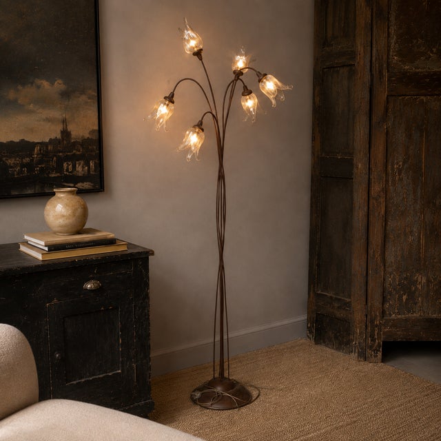 Elegant six-light floor lamp dating from the 1970s, featuring handcrafted Murano glass shades in the form of delicate...