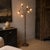 Elegant six-light floor lamp dating from the 1970s, featuring handcrafted Murano glass shades in the form of delicate...