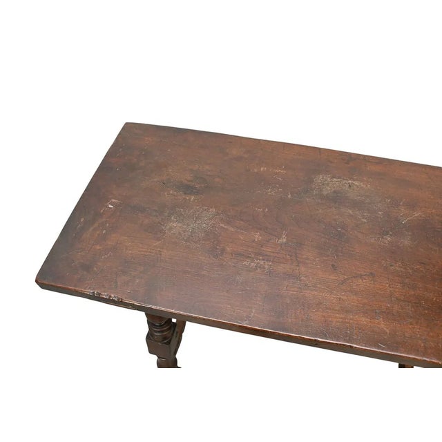 This product is an Antique Spanish Colonial 19th c. Trestle Table with Iron Stretcher. It is a fully assembled accent...