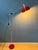 Flexible Anvia 'rod' floor lamp in red colour. The position of both the shade and the arm can easily be adjusted. The lamp...