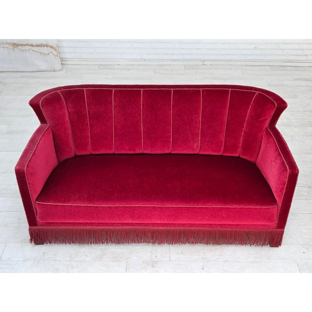 1960s, Danish 2-seater sofa. Original red furniture velour, ash wood legs, brass springs in the seat. Original good...