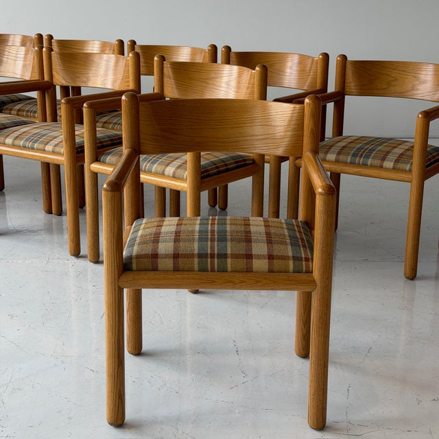 c. 1970s. Price is for the set of 12. Reupholstered in plaid fabric. This piece is attributed to the mentioned...