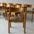 c. 1970s. Price is for the set of 12. Reupholstered in plaid fabric. This piece is attributed to the mentioned...