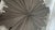 A striking, highly dimensional Mid-Century Modern sunburst wall sculpture featuring a bold Brutalist layout. This...