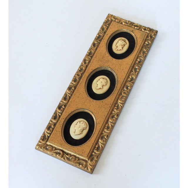 Vintage Syroco triple cameo wall hanging with Roman figures and brown velvet back drop. Minor age wear. Ready to hang. No...