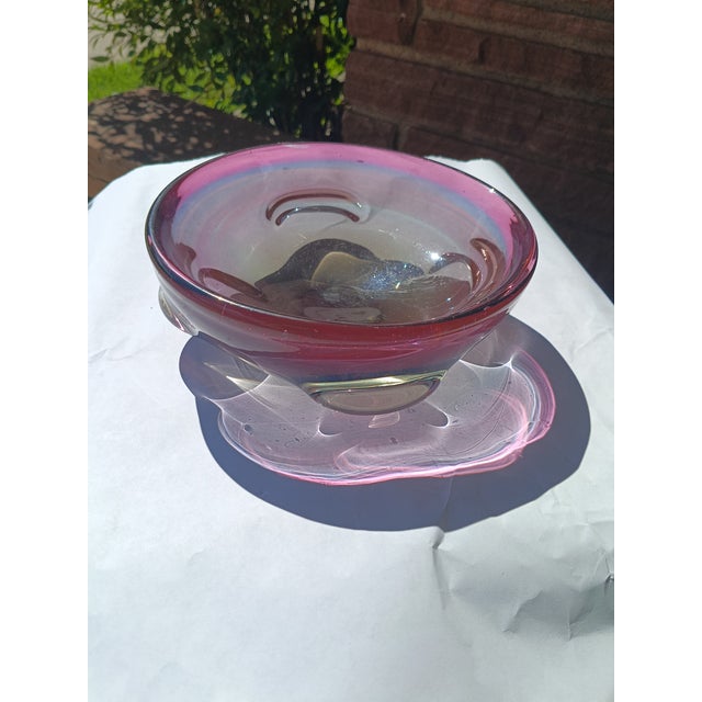 This substantial mid-century Murano-attributed sommerso glass catchall features a deep amethyst, blue and black core...