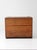 A 19th-century primitive wood chest with a warm, timeworn surface and simple plank construction. The lift top opens to a...