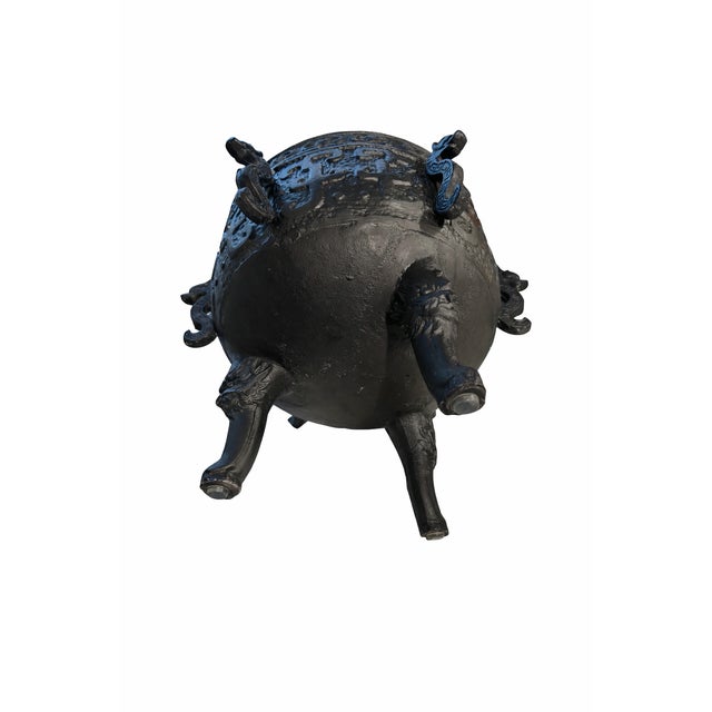 Striking 1970s cast metal ice bucket featuring sculptural dragon-form side handles and embossed decorative detailing...