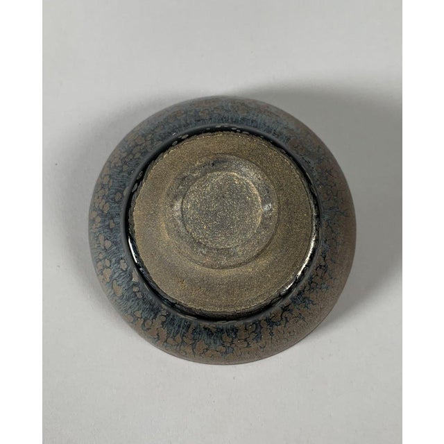 Stoneware bowl with iridescent black glaze, "hare's fur" pattern. Jianyao. In the style of the Song Dynasty (960-1279) ,...