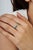 Crafted in 925 sterling silver, this contemporary infinity ring features vibrant square-cut emeralds totaling 1.43 carats,...