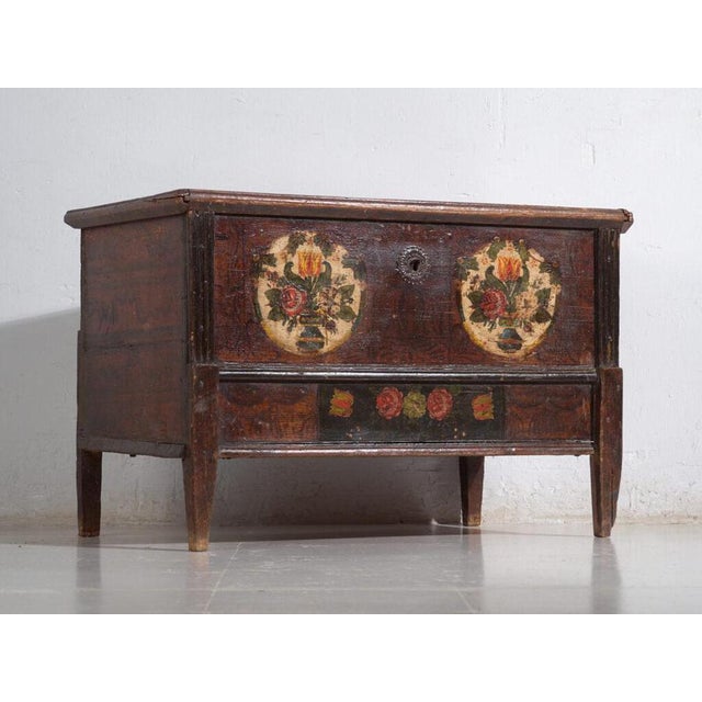 Antique central european dowry chest in pine, hand-painted with floral cartouches across the front and dated to circa...