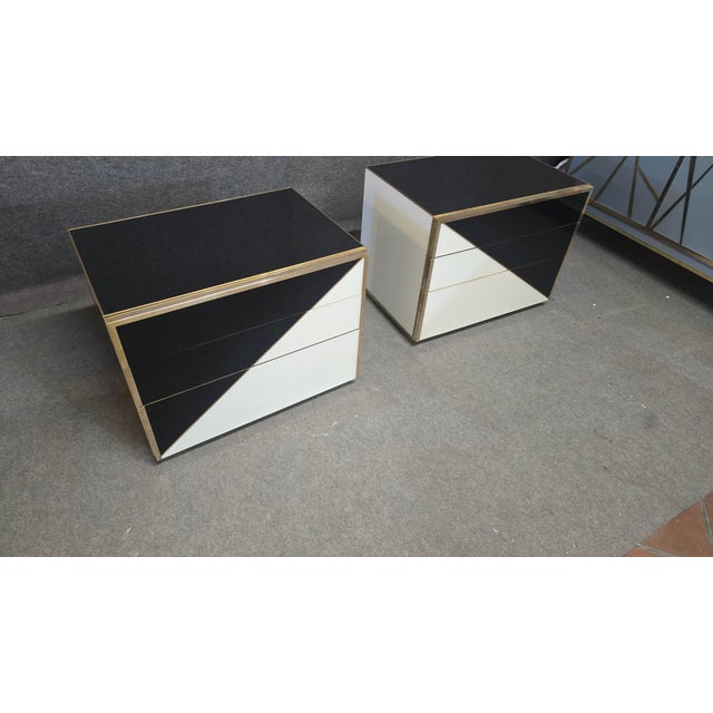 A pair of bedside tables by **Justfurnituress**, featuring an exclusive modular design with interchangeable drawers that...