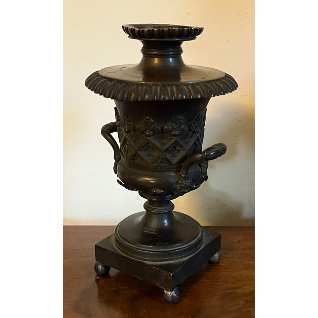 Antique early 19th century English Regency bronze urn form cassoulet candlestick holder in the Gothic taste. The lid is...