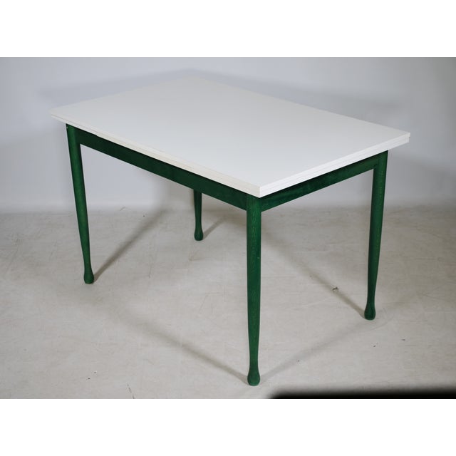 Extendable dining table from Italy, 1970s. A simple design with clean lines. Rectangular white tabletop combined with a...