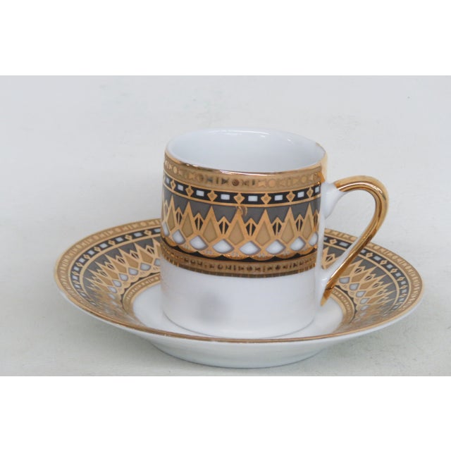 This gorgeous espresso cup and saucer set is made of fine porcelain and plated with 24ct gold. This set is stamped as...