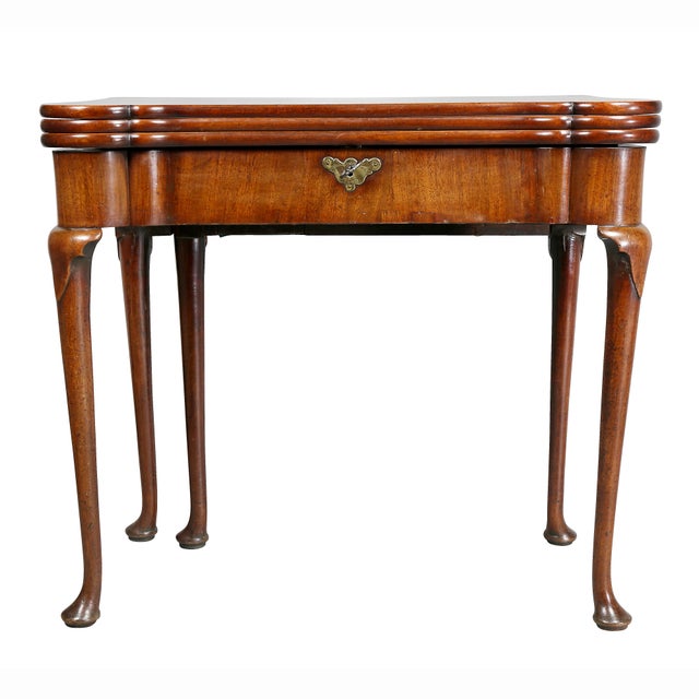 Games table with triple hinged top with turret corners opening to a fitted card surface and backgammon, ratcheted reading...