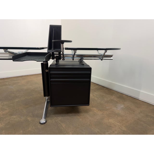 An iconic modular executive desk designed by Bruce Burdick for Herman Miller, circa 1980s. This sophisticated workstation...