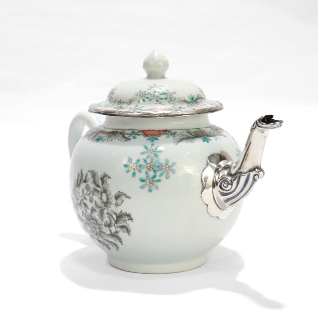 A fine 18th century Chinese Export porcelain teapot. Decorated throughout with flowers & floral sprays en grisaille and...