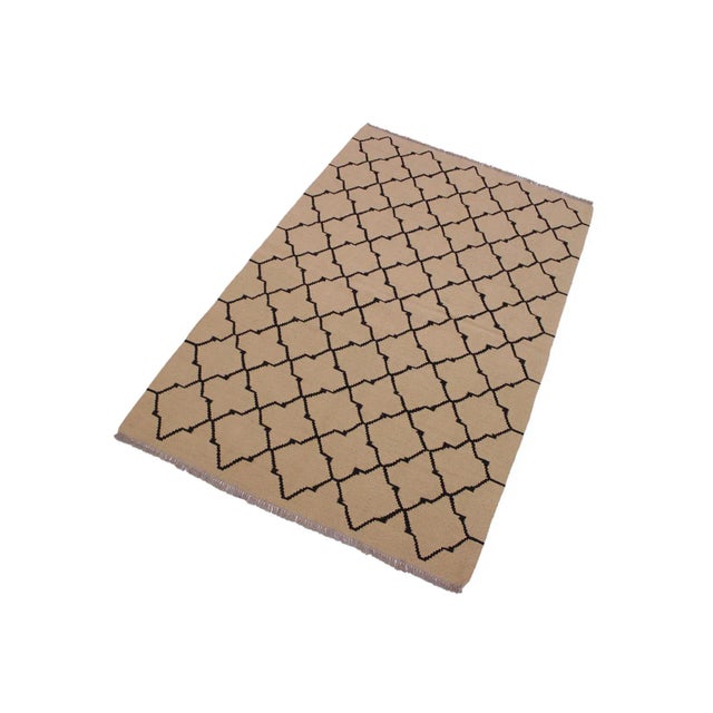 "Add a touch of elegance to your home with this casual chic hand woven Tribal Kilim wool rug. Constructed on a loom by...