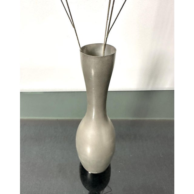 A refined artistic composition from the 1970s that combines the craftsmanship of metal with the lightness of natural...