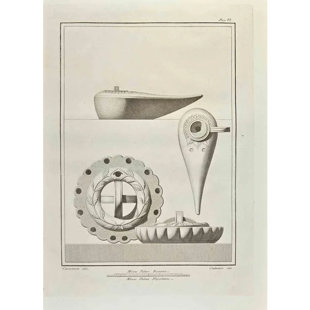Roman Objects from "Antiquities of Herculaneum" is an etching on paper realized by Aniello Cataneo in the 18th Century....