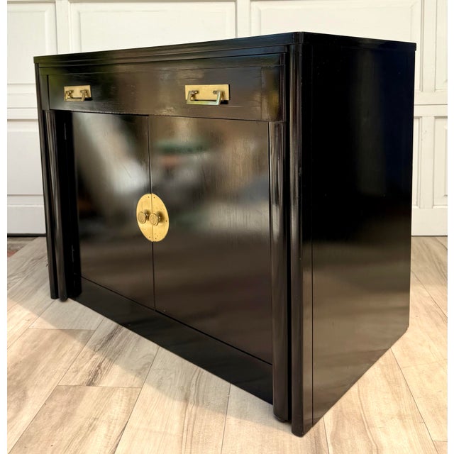Dating to 1958, this ingenious black lacquer cabinet is one of those pieces that completely surprised me. At first glance...