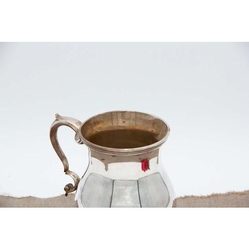 Plain Silver Water Jug with Embossed Handle, in Very Good conditions. Designed 1920 to 1949 This piece has an attribution...