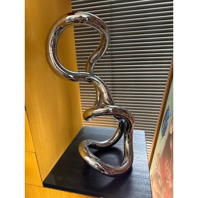 This highly dynamic and brilliantly designed Mid-Century Modernist Kinetic "Tangle" Sculpture in Polished Chrome abs by...
