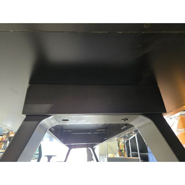 The Decca Gait 72x36" Table-Desk with a black painted glass top is a minimalist, high-end piece designed by Erin Ruby for...