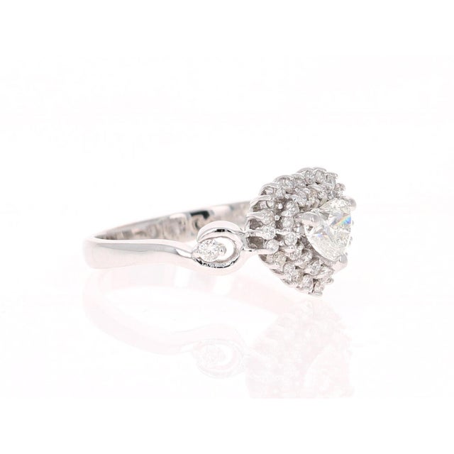 A Beautiful and Unique Engagement Ring with a Heart Cut Diamond. This unique ring has a heart cut diamond weighing 0.51...