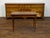 A French Restauration period wooden side table from the early 19th century, with leather top, lateral drawer and tapered...
