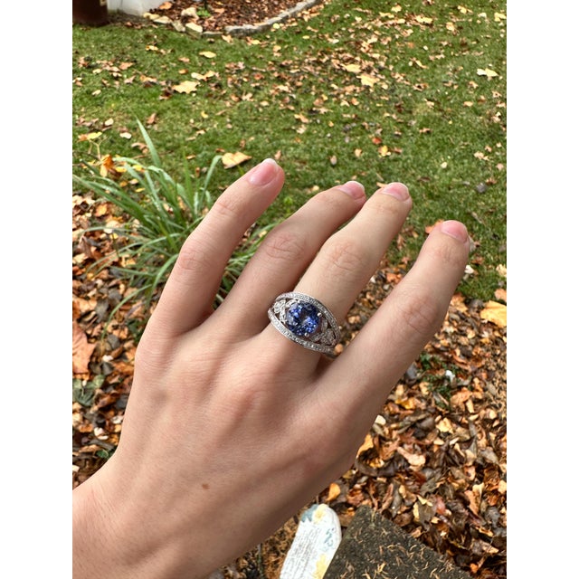 Elegant 3.19ct Tanzanite Ring in solid 14k White Gold with earth mined Diamond Accents. Featuring an intricate design and...