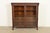 An outstanding antique American Empire or Victorian double bookcase cabinet with lion heads and paw feet In the manner of...