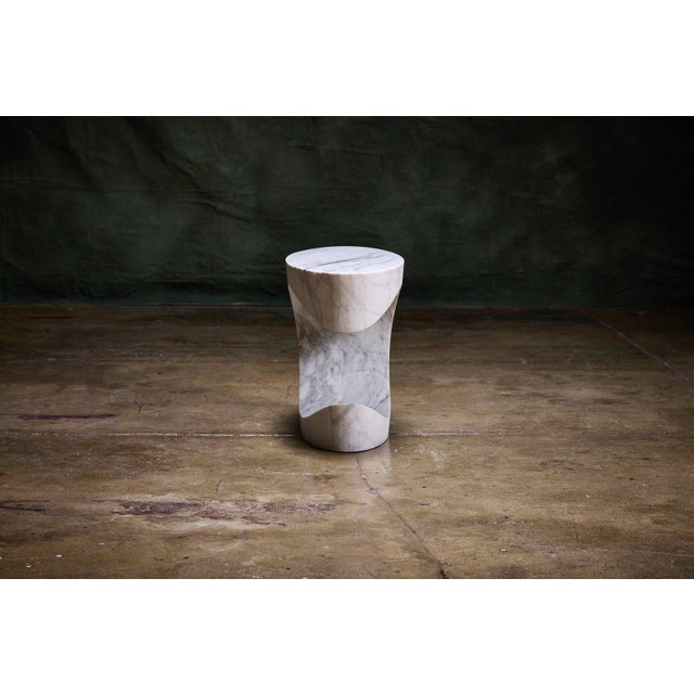 Sutherland Stefan Gulassa contemporary side table crafted from solid Carrara marble with a unique curved 'C' shape design....