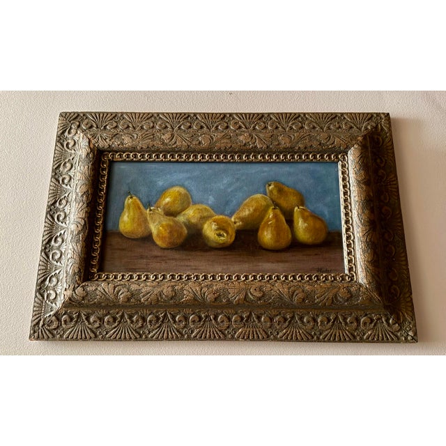Original oil painting of a grouping of pears by Texas artist, Jill Pavlas. Framed in an antique carved wood frame.