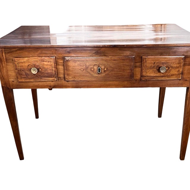 Neoclassical writing desk handmade in Italy in the late 1700s using walnut and peg construction. The writing desk features...