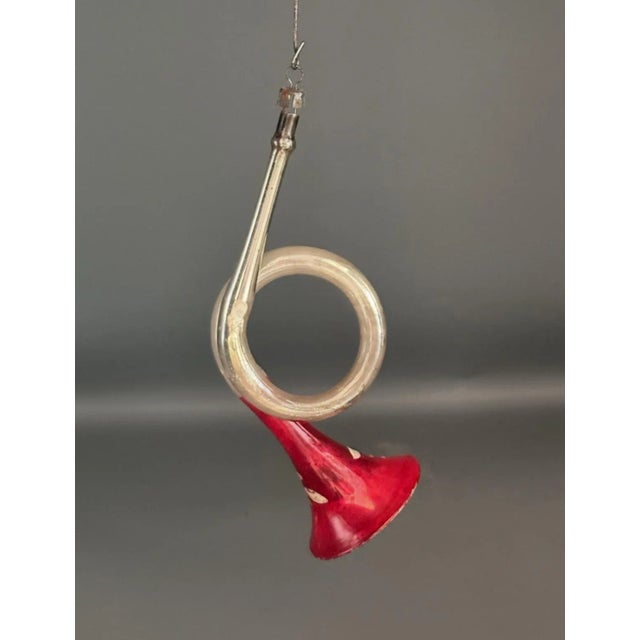 A charming pair of hand-blown German glass trumpet ornaments from the 1920s, each adorned with delicate hand-painted...