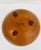 Vintage wooden bowl with hand-painted pinecone and evergreen branch decoration along the interior rim. Features a warm...
